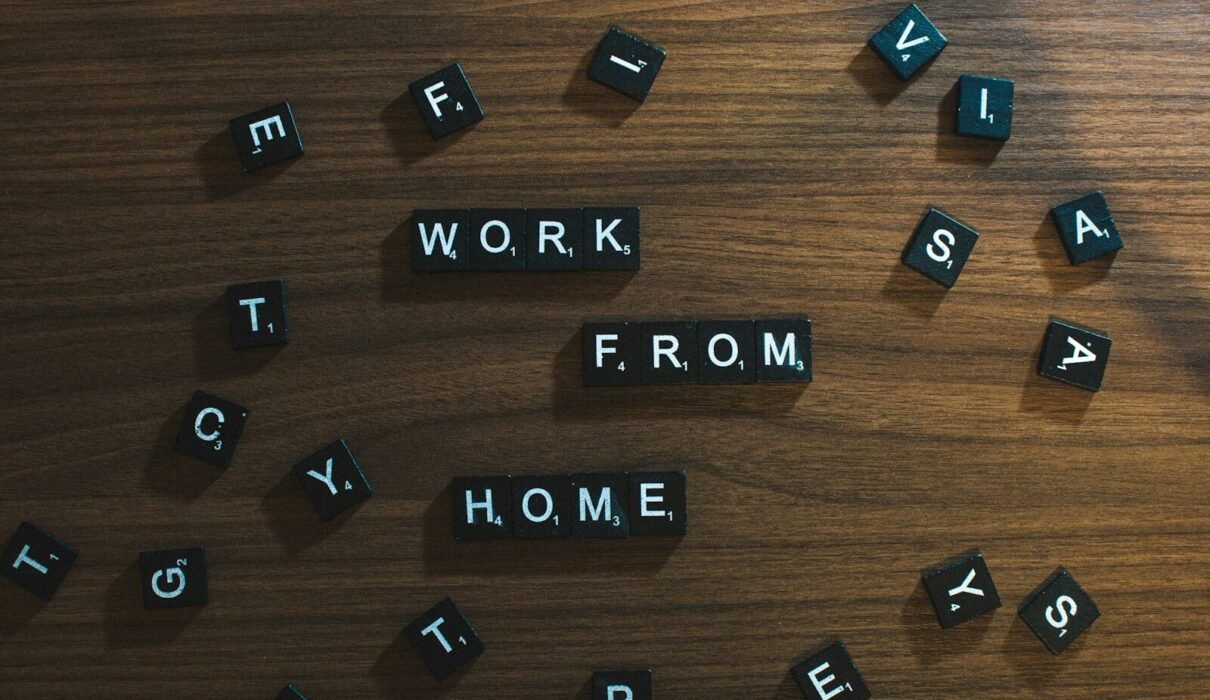 a wooden table topped with scrabbled letters
