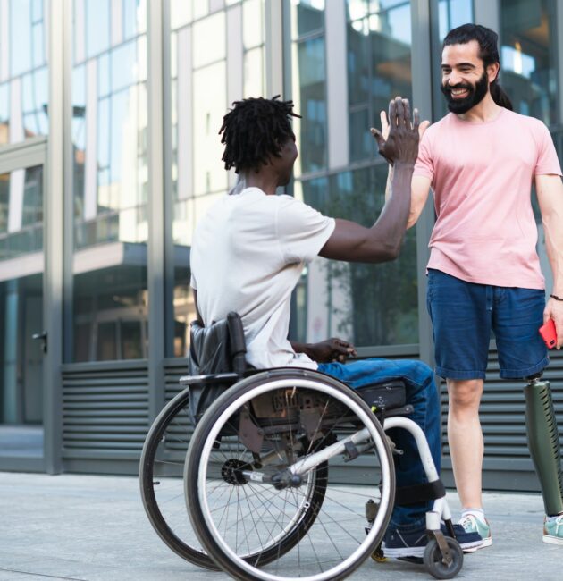 A pair of disabled friends on vacation having fun and breaking down barriers.