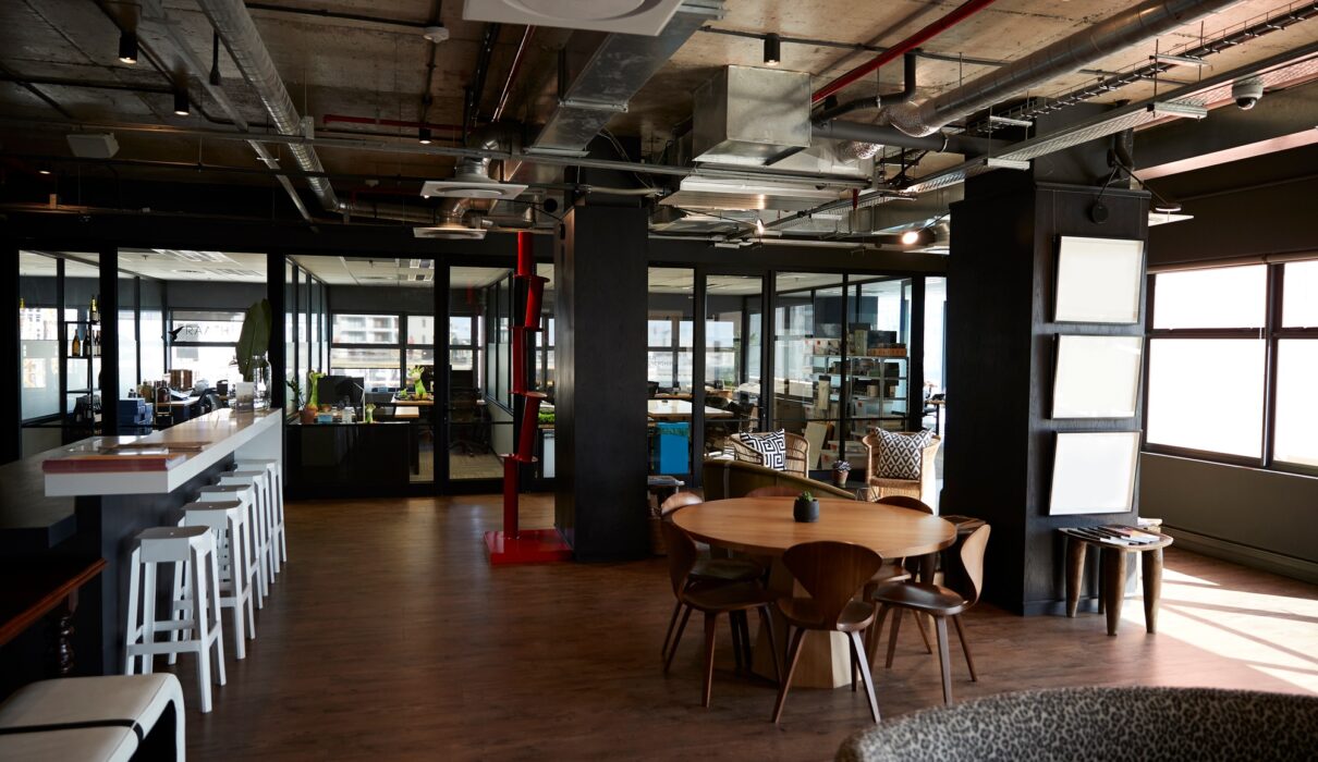 Bar and dining area in the office of a creative business, in daylight, no people