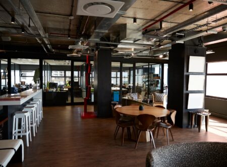 Bar and dining area in the office of a creative business, in daylight, no people