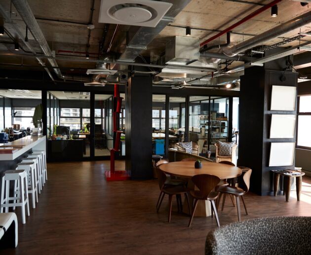 Bar and dining area in the office of a creative business, in daylight, no people