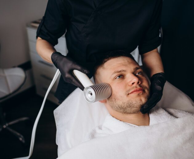 Face cryomassage, caucasian man. Skin cryotherapy close up. Liquid nitrogen use in medicine