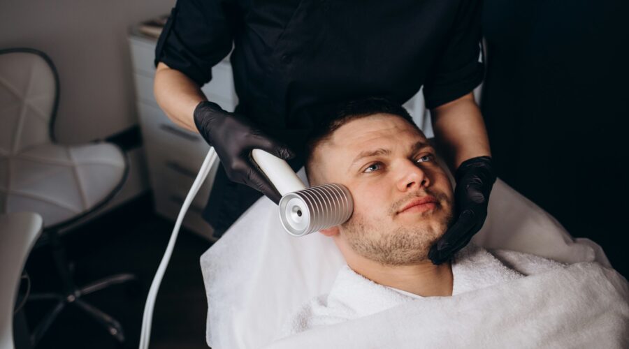 Face cryomassage, caucasian man. Skin cryotherapy close up. Liquid nitrogen use in medicine