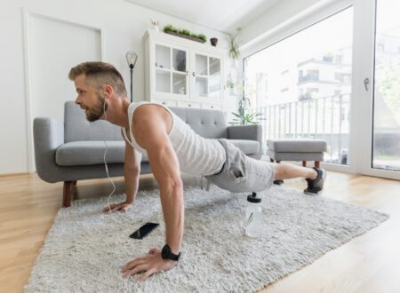 Handsome man working out at home