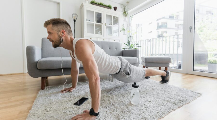 Handsome man working out at home