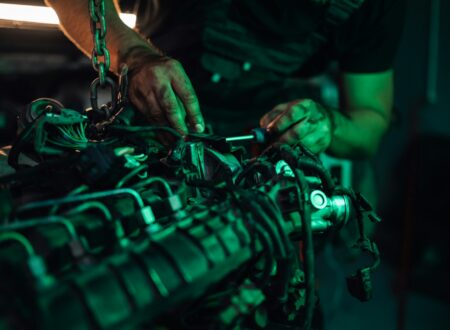 Mechanic working on the detailed parts of a vehicle engine