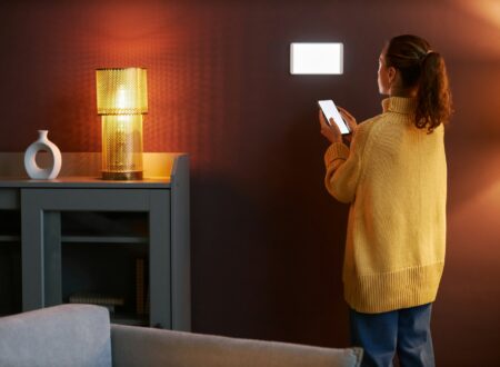 Young woman using digital smart home system